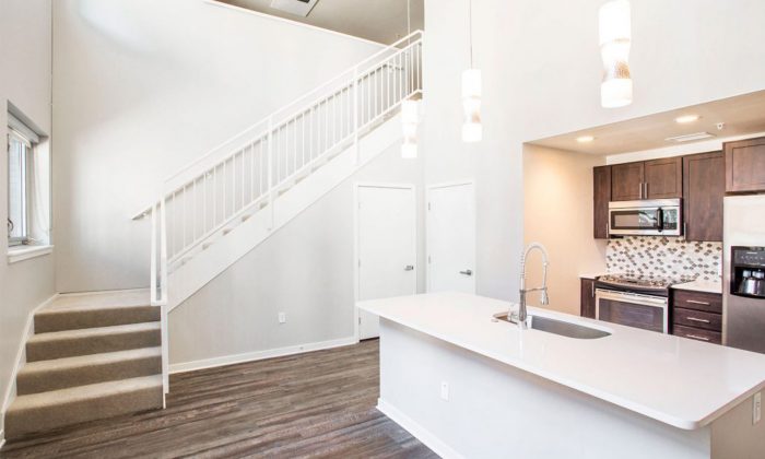 luxury two-story apartment kitchen and staircase
