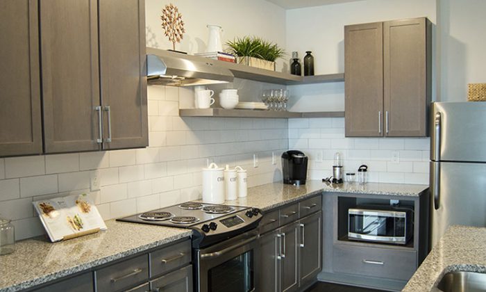modern apartment kitchen with tile backsplash