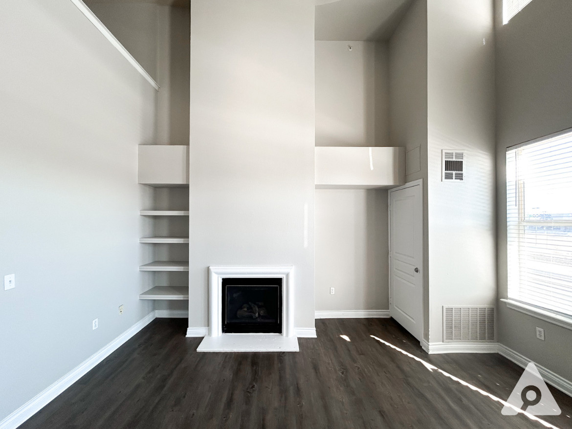 Denver Apartment - Living Space with Electric Fireplace and built-in bookshelf