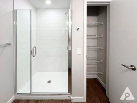 Denver Apartment - Bathroom with storage and glass door shower
