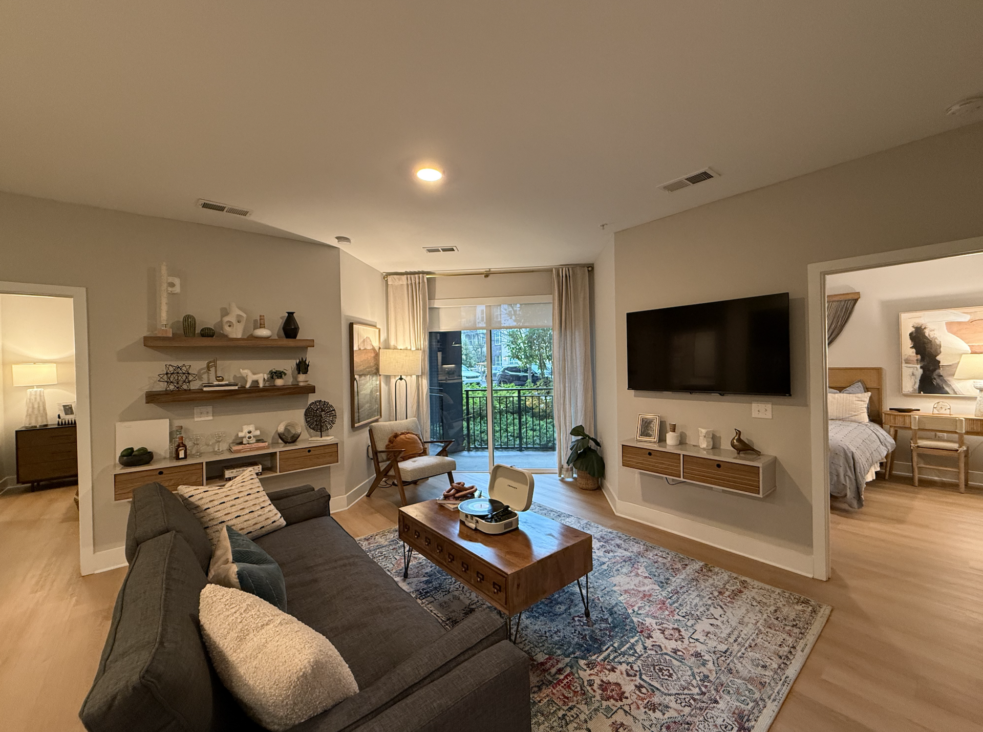 Open layout living room in Germantown apartment. Connected to the living room is private patio/balcony.