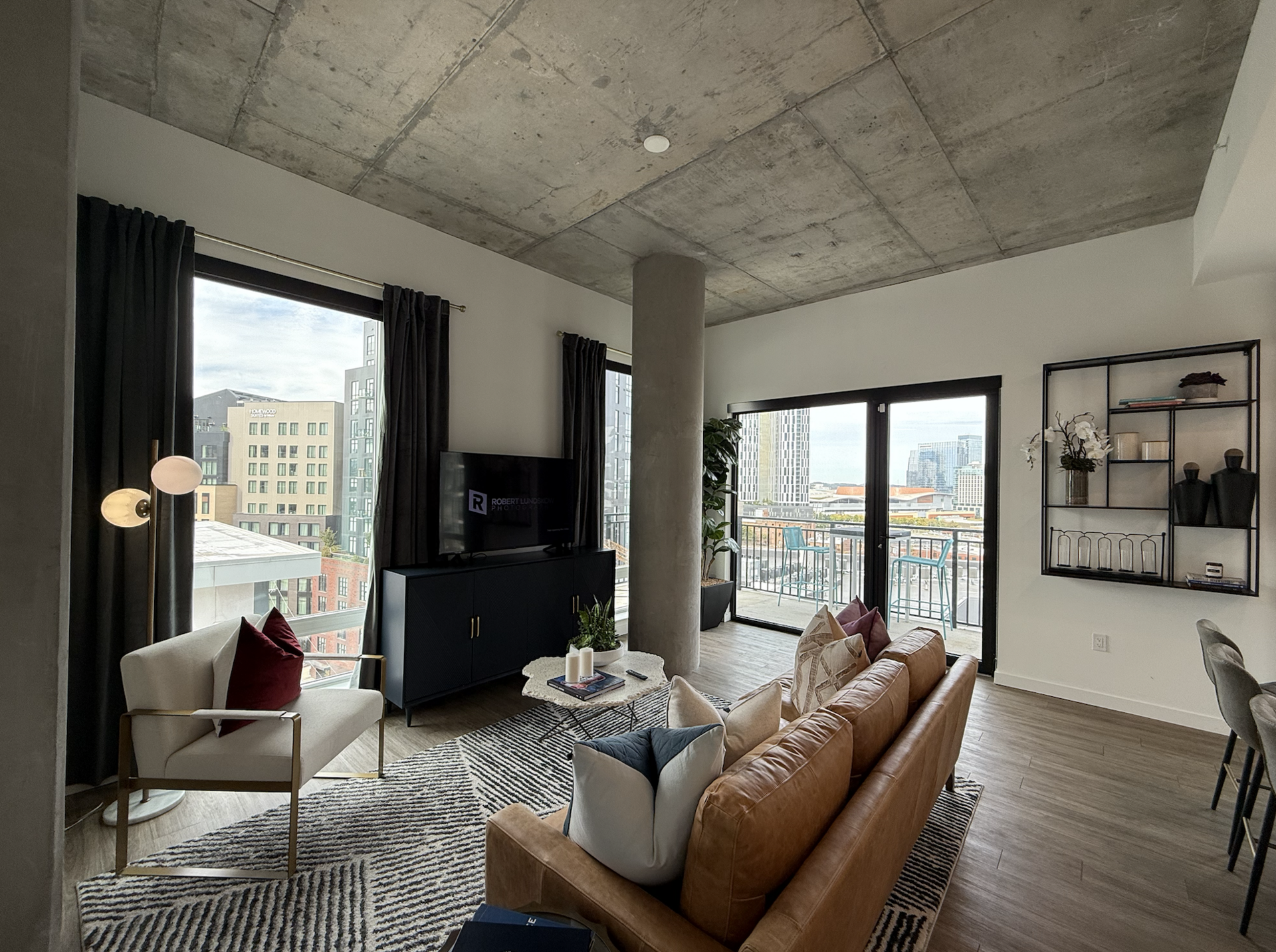 Nashville apartment living room with concrete accents and tons of natural light.