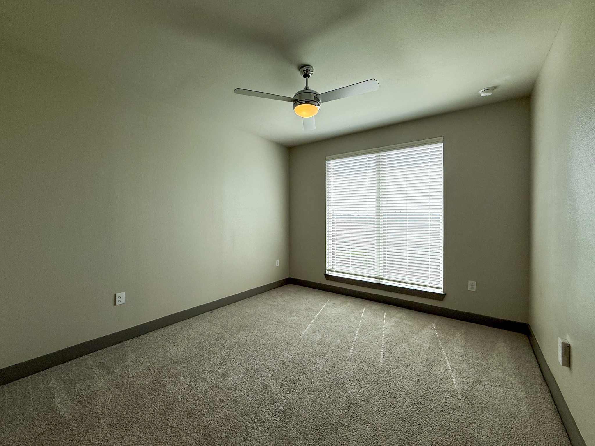 Modern San Antonio apartment bedroom with natural lighting