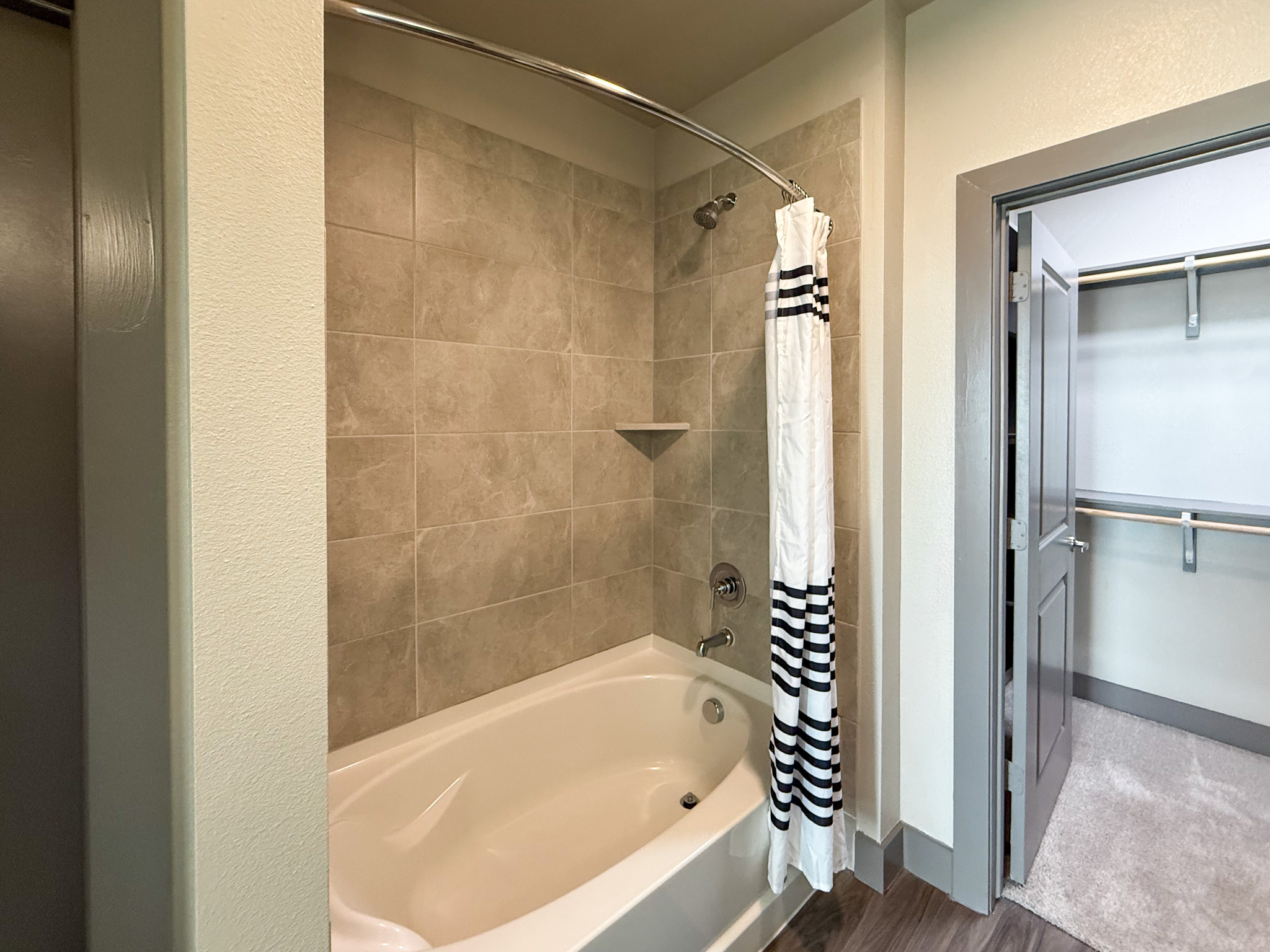 Modern San Antonio apartment shower with grey finshes
