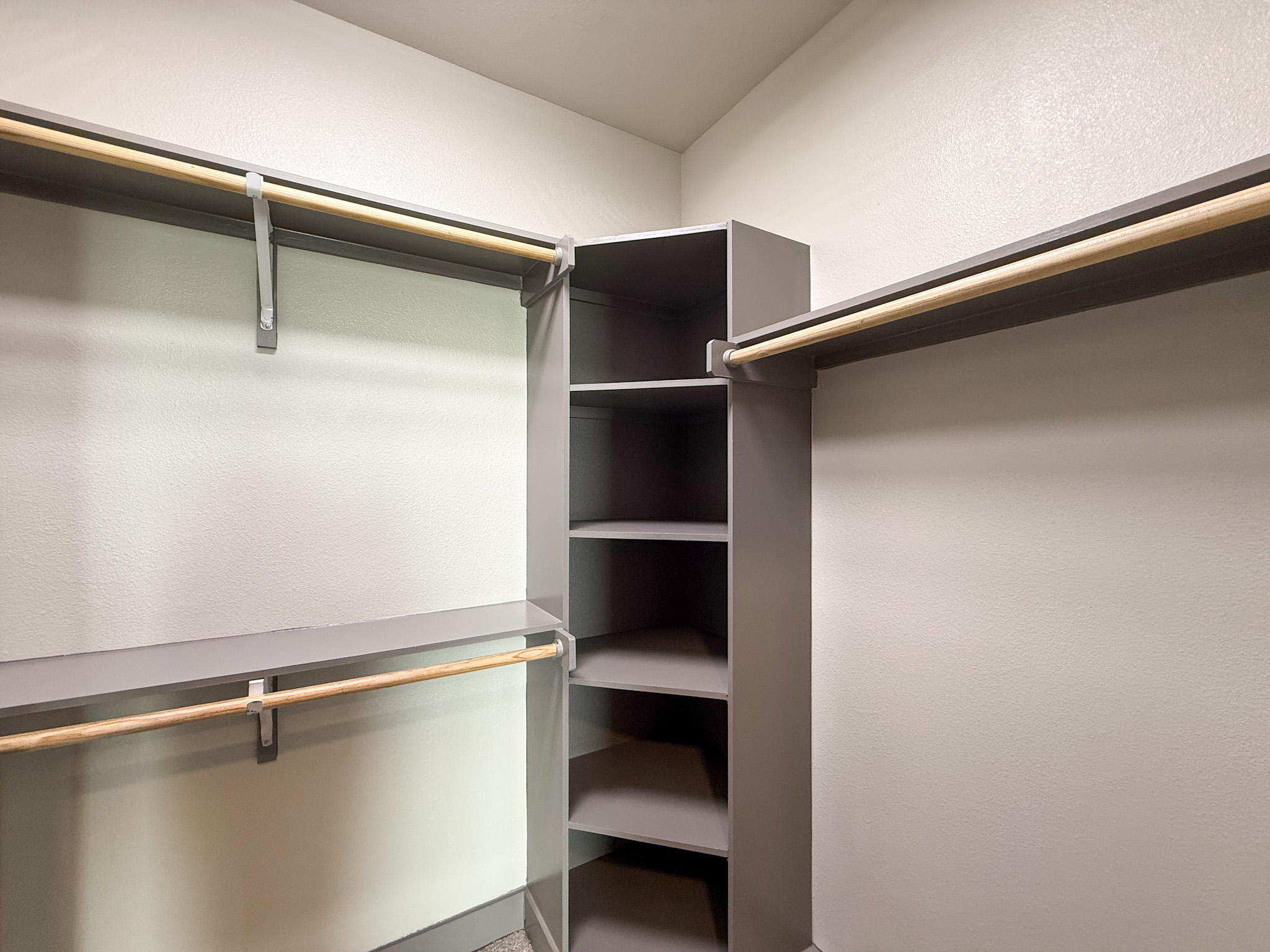 Modern San Antonio apartment closet with grey finshes