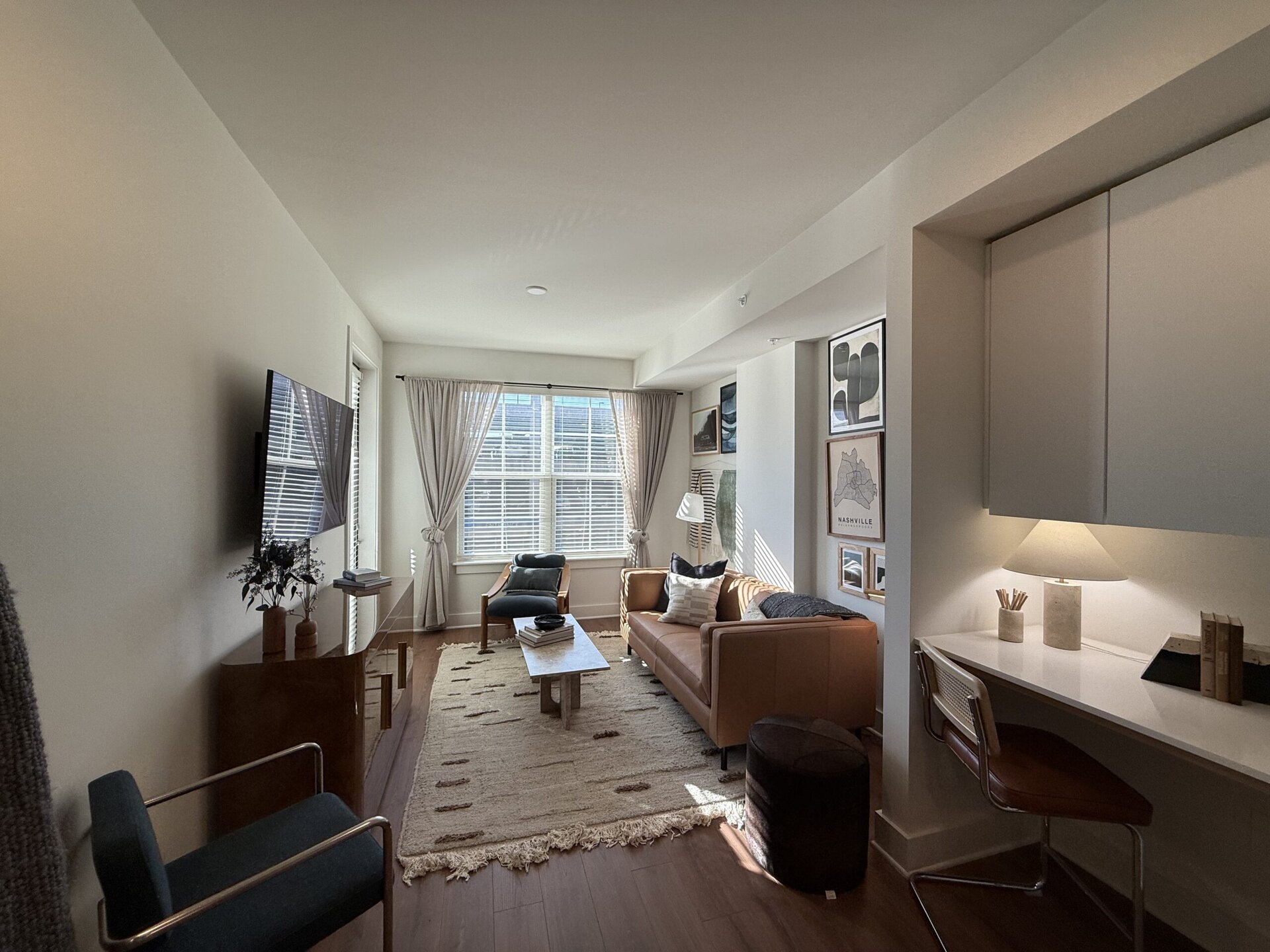 Germantown apartment living room with a built in desk area, perfect for remote workers.