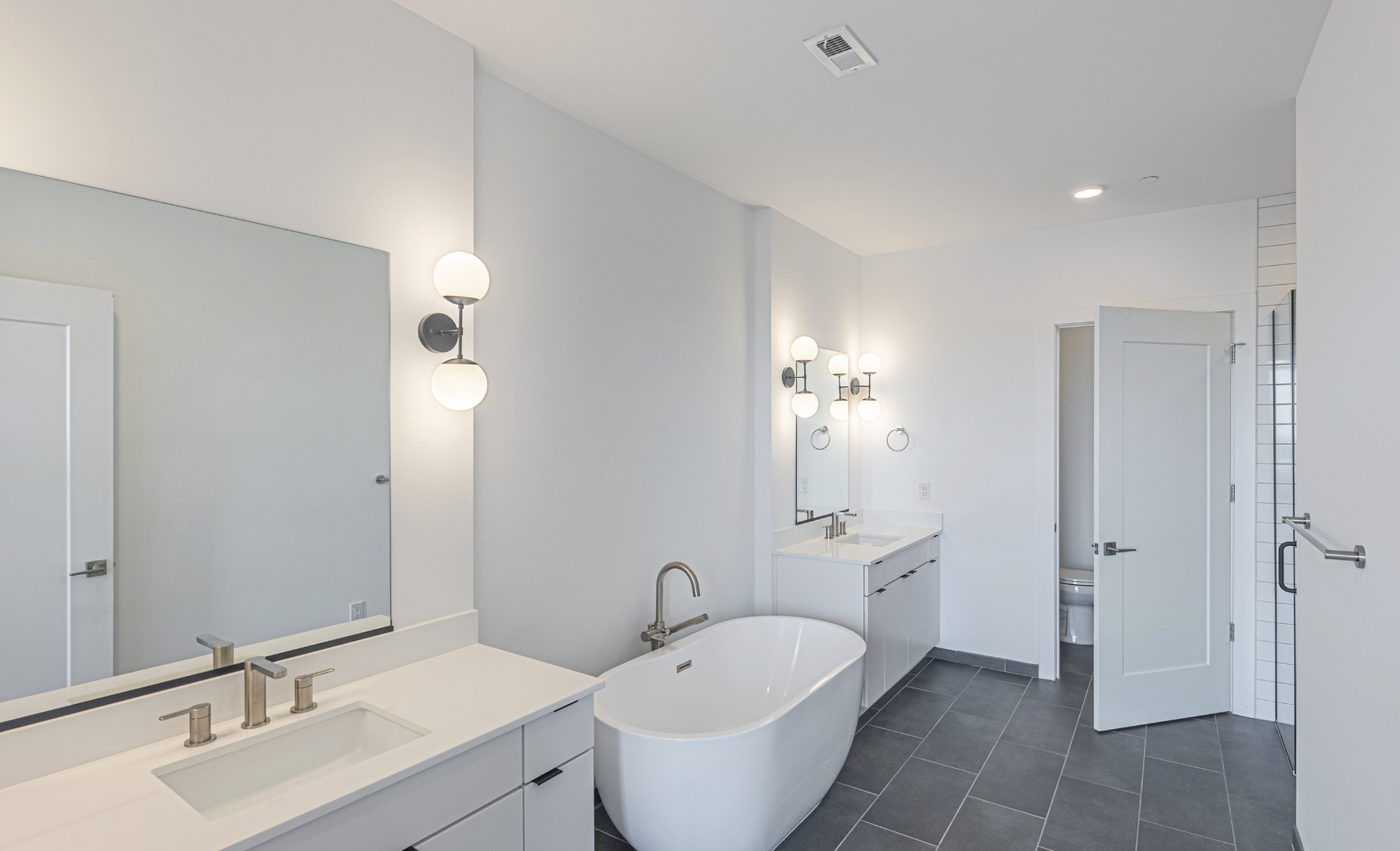 Reynoldstown apartment bathroom with standalone tub.