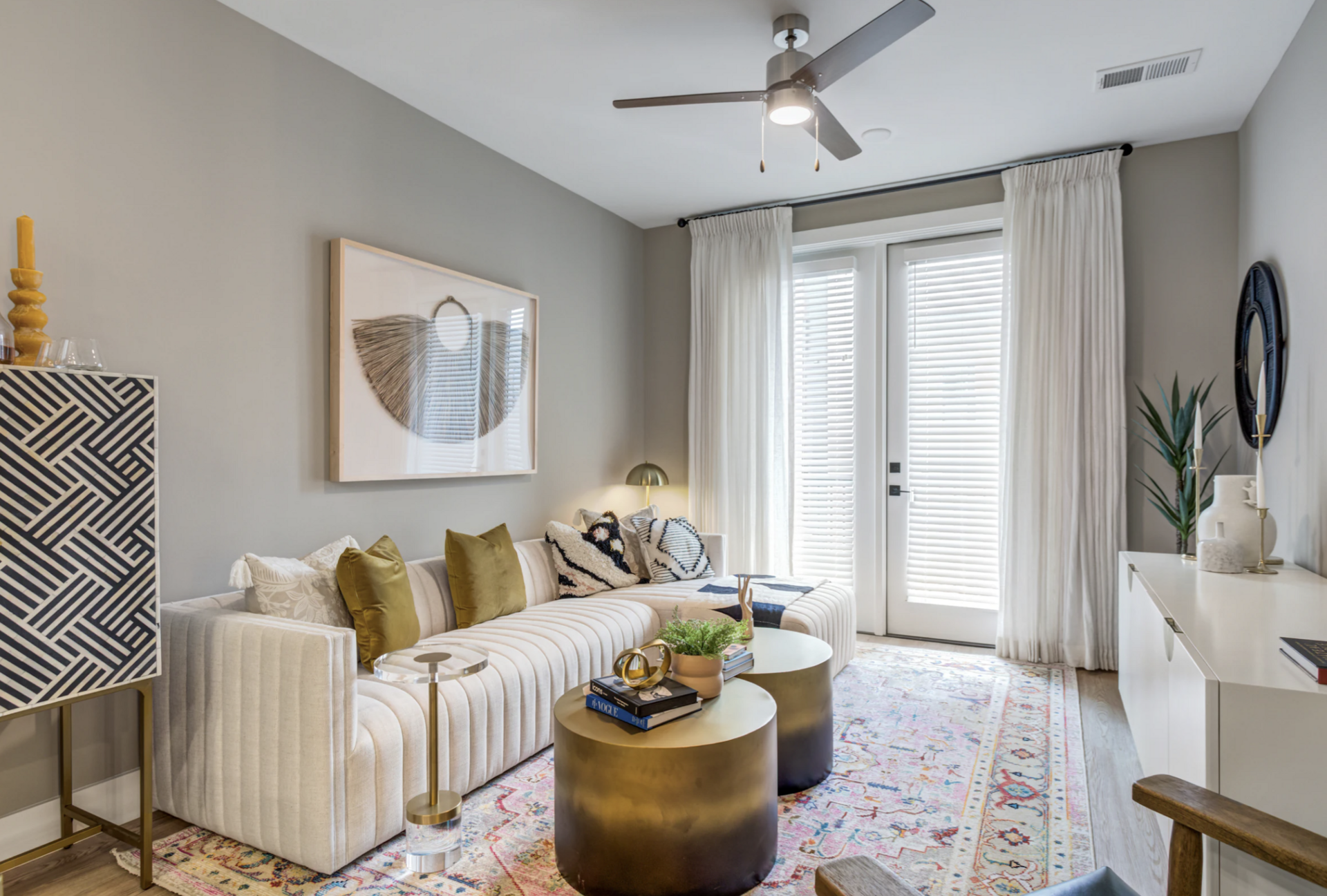 Nashville Midtown apartment living room with tall windows.