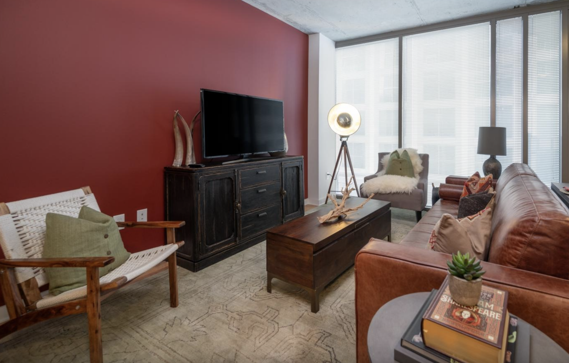 Midtown Atlanta apartment living room with floor to ceiling windows.
