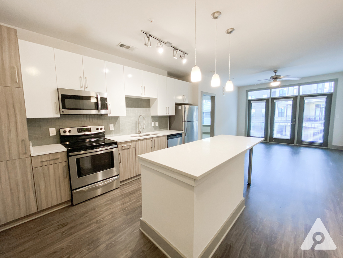 West Midtown Atlanta apartment kitchen with bright, light finishes and updated appliances.