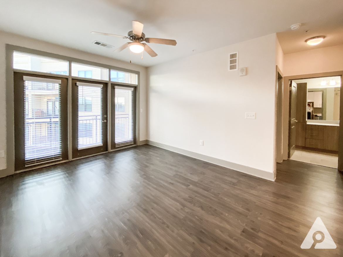 West Midtown Atlanta apartment living room full of natural light from big windows.