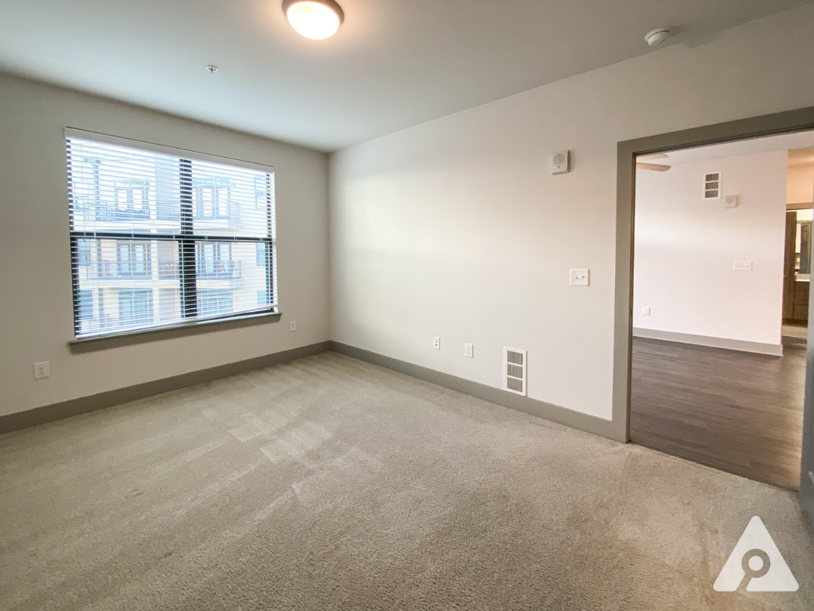 West Midtown Atlanta apartment bedroom with large windows.