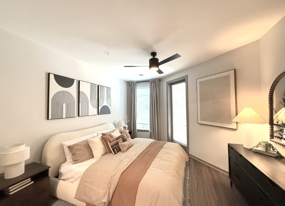 Downtown Nashville apartment bedroom with balcony access.