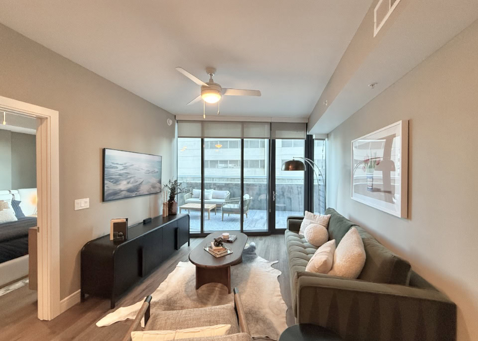Downtown Nashville apartment living room with floor to ceilings windows.