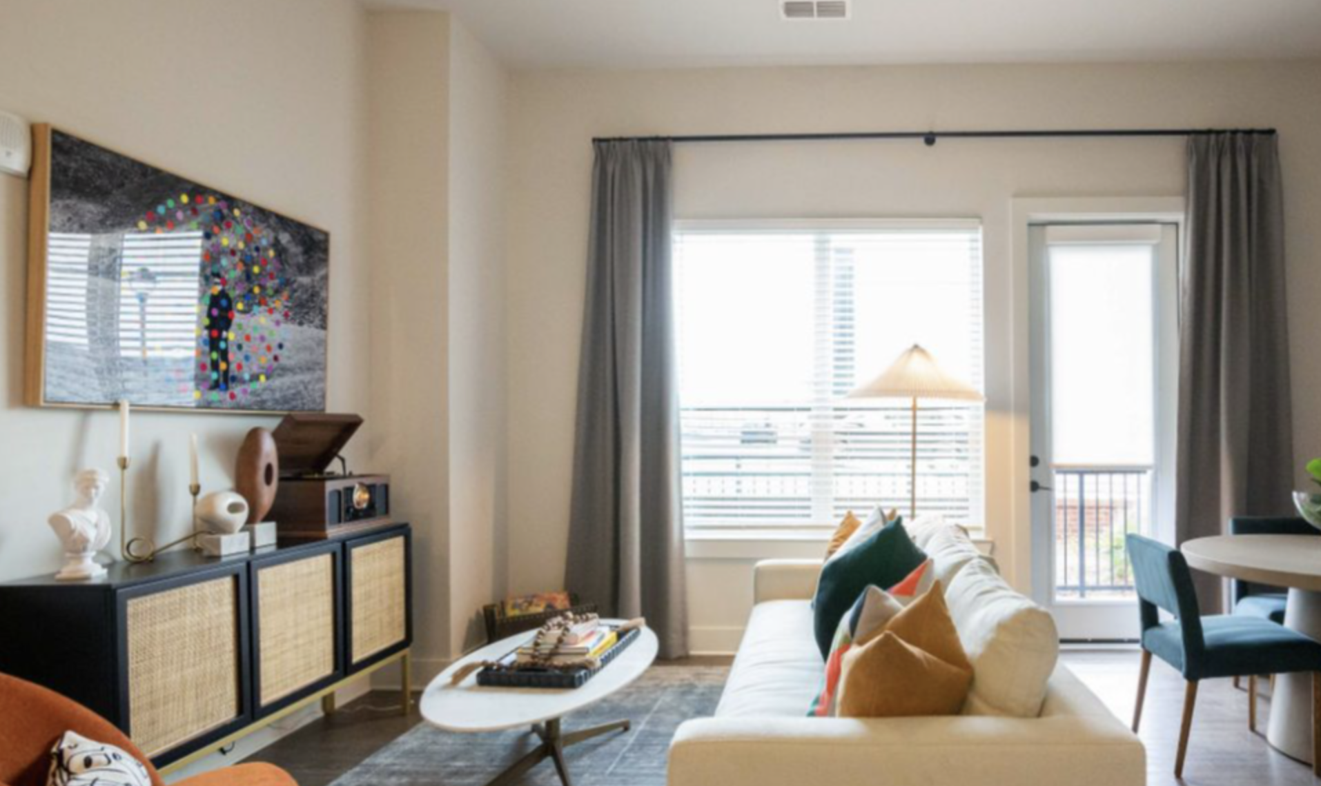 Decatur apartment living room with wood flooring and big windows.