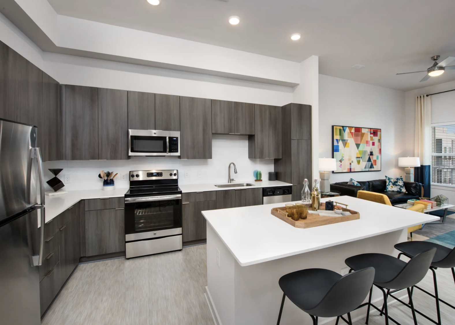 Midtown Atlanta apartment kitchen with dark brown cabinets and plenty of counter and storage space.