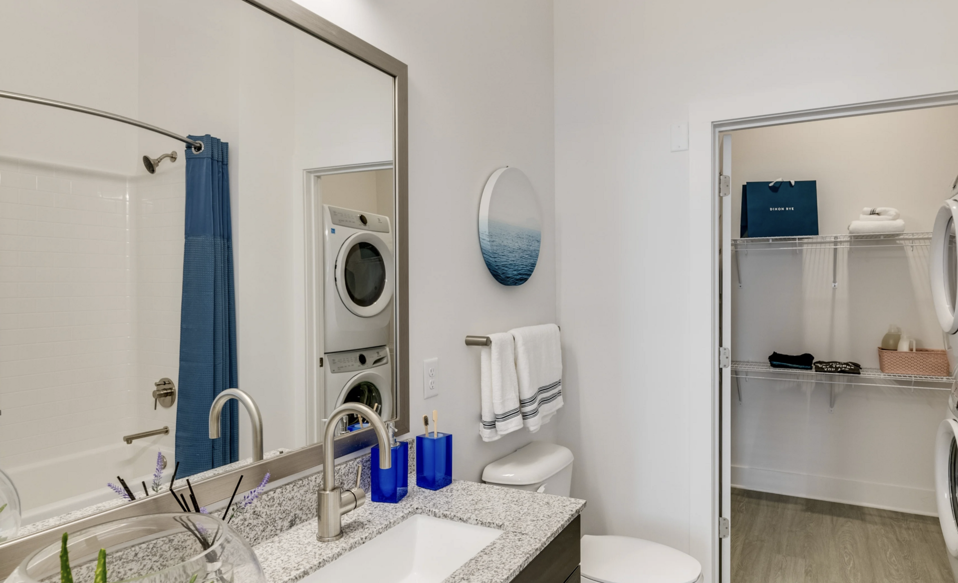 Grant Park apartment bathroom with a connected walk in closet and in unit laundry.