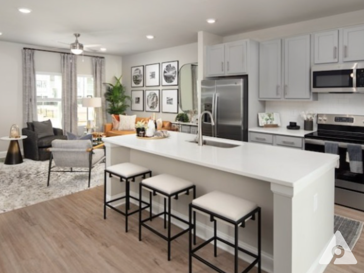 Atlanta townhomes kitchen with a massive island and tons of storage.