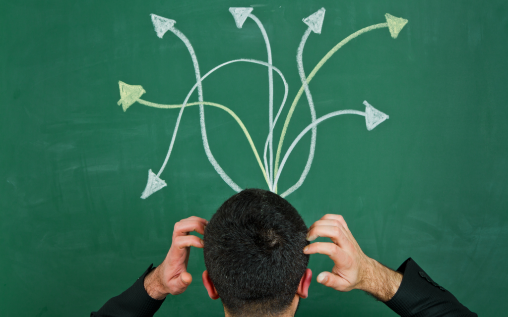 Confused about which Electric Plan he should choose. A mans head with a lot of arrows going in different directions