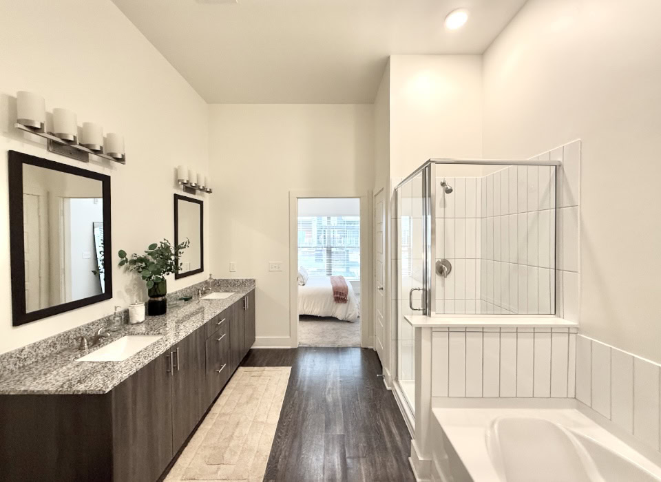 East Nashville apartment bathroom with a large double vanity, and a shower and tub combo.