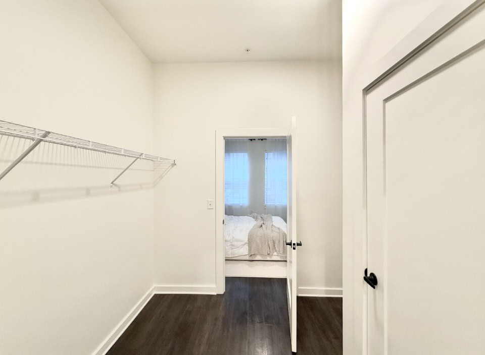 Germantown apartment walk-in closet with ample space and organization racks.