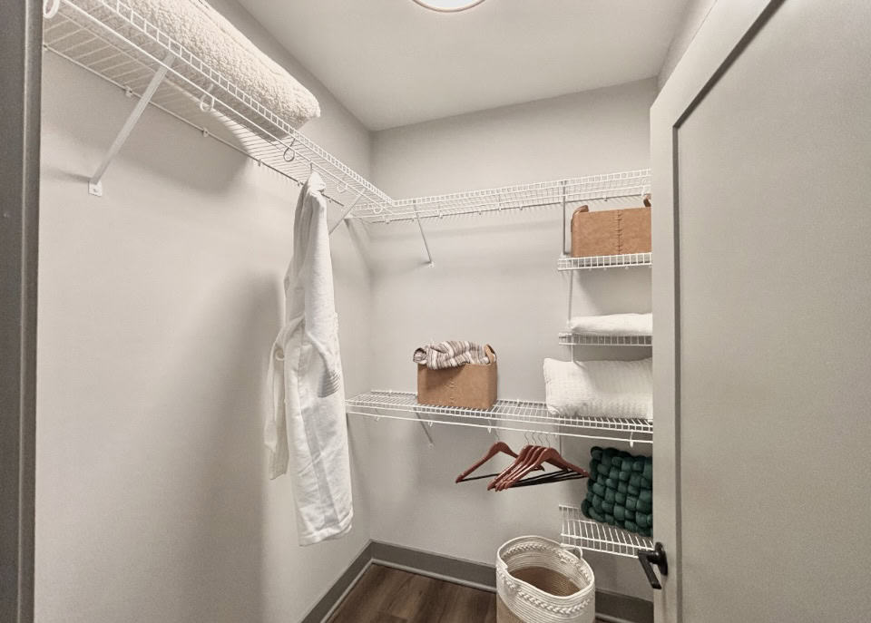 Apartments in Germantown, walk in closet with tons of organization racks.