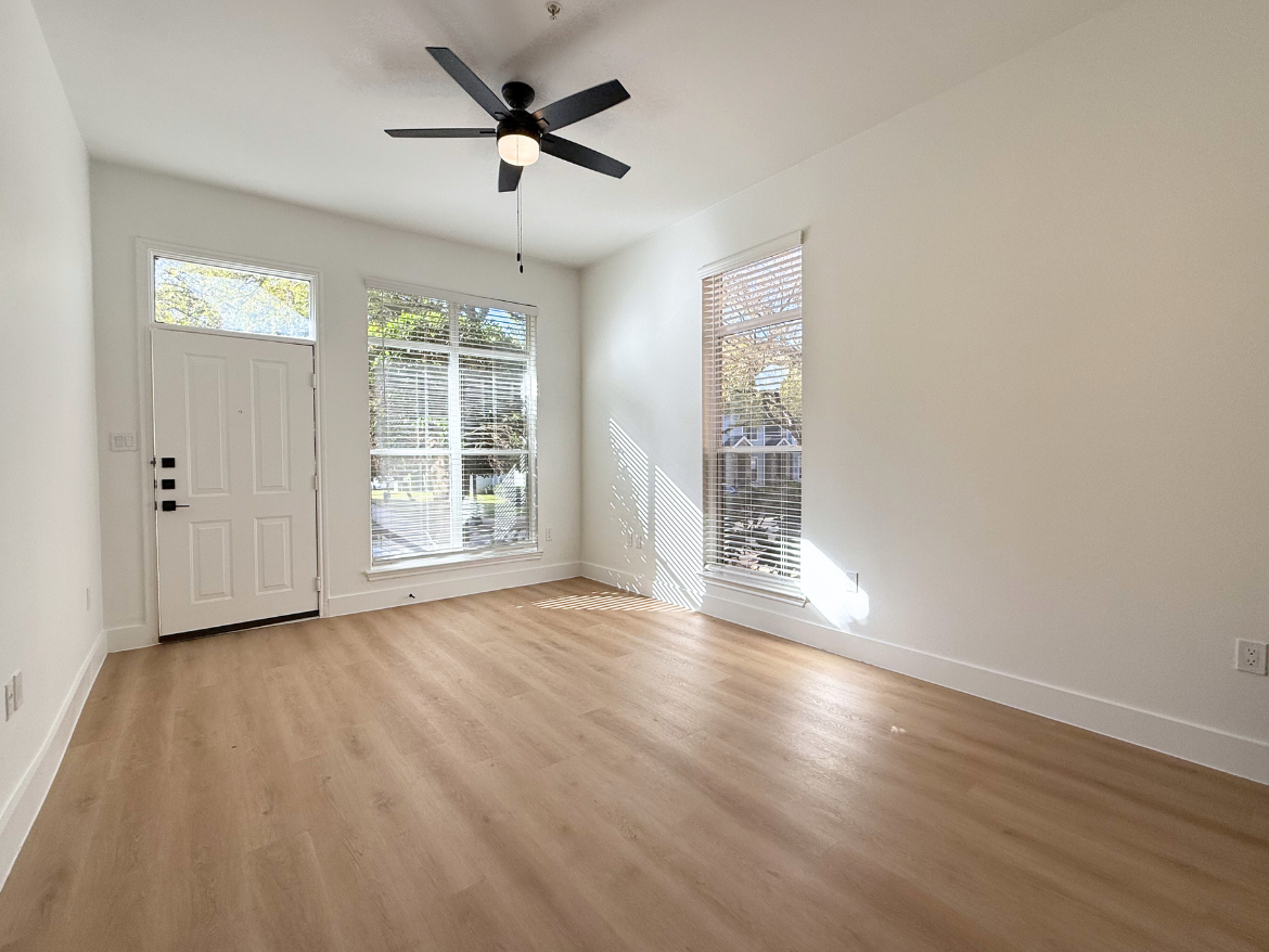 The Colony apartment living room with wood style flooring