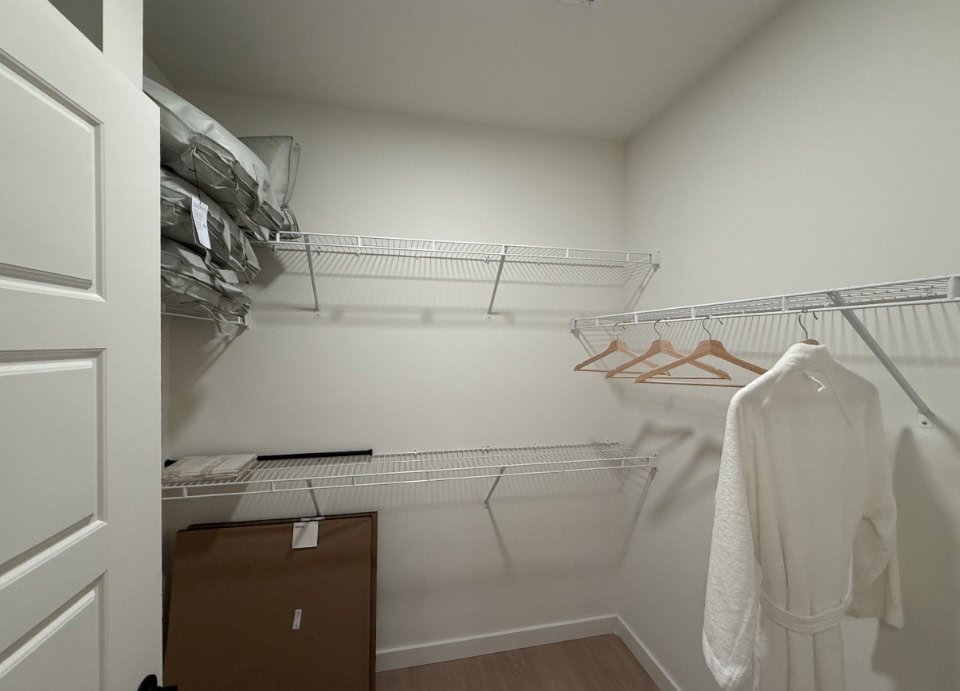 Nashville Apartment walk-in closet with organization racks.