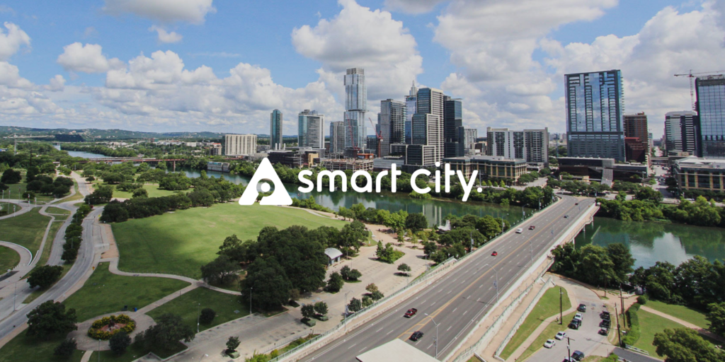 Smart City logo across the Austin Texas Skyline