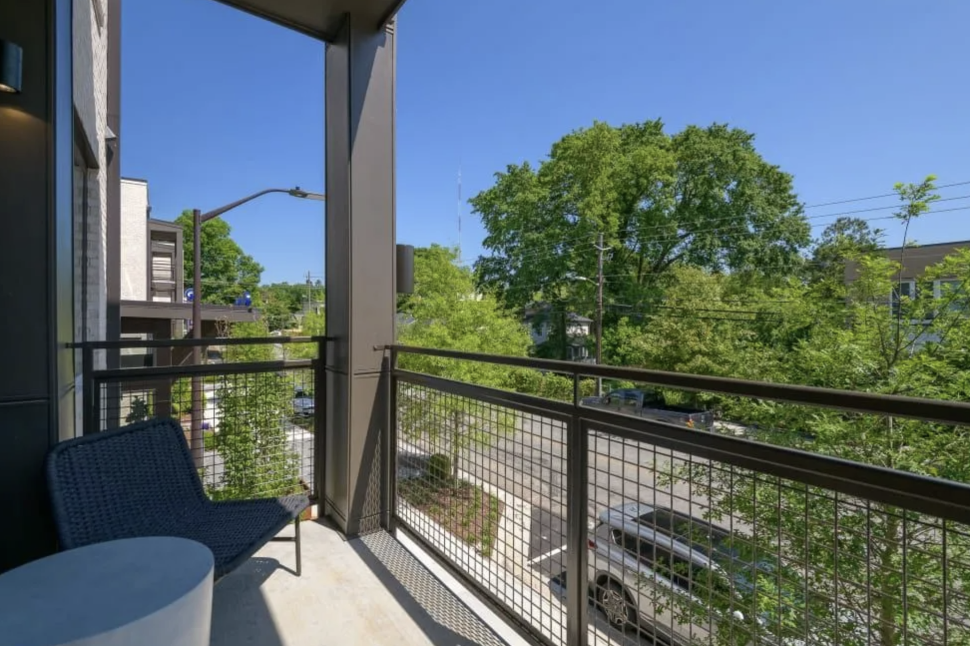 Atlanta Apartment balcony surrounded by tons of trees.