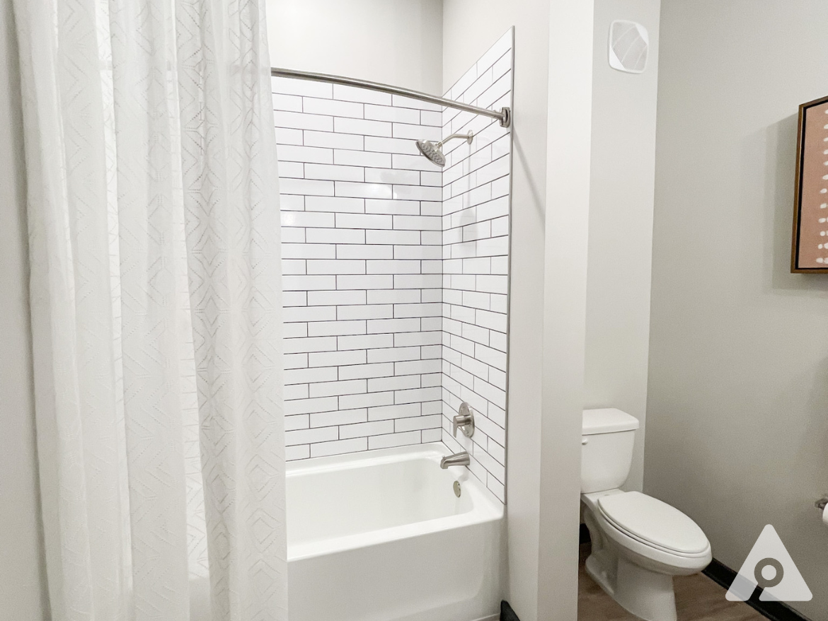 Atlanta Apartment bathroom with a bath tub.
