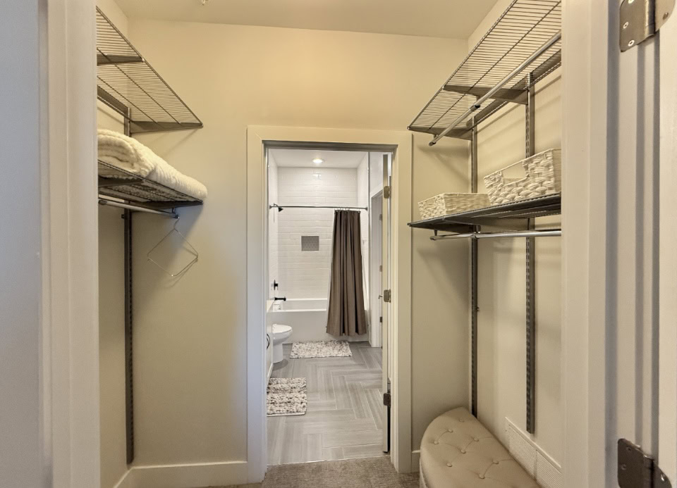 Nashville Apartment walk in closet with adjustable organization racks.