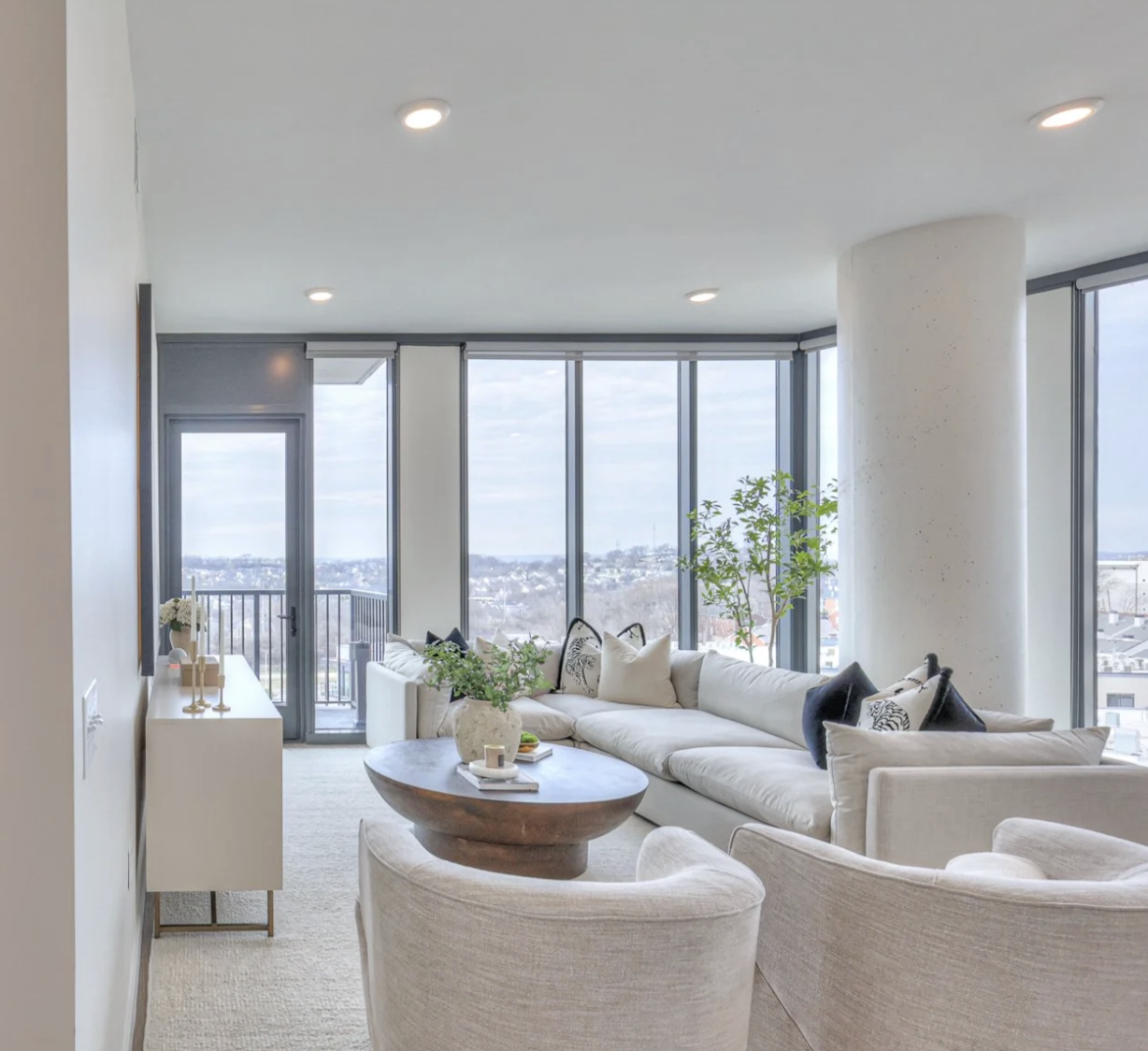 Nashville Apartment living space with floor to ceiling windows.