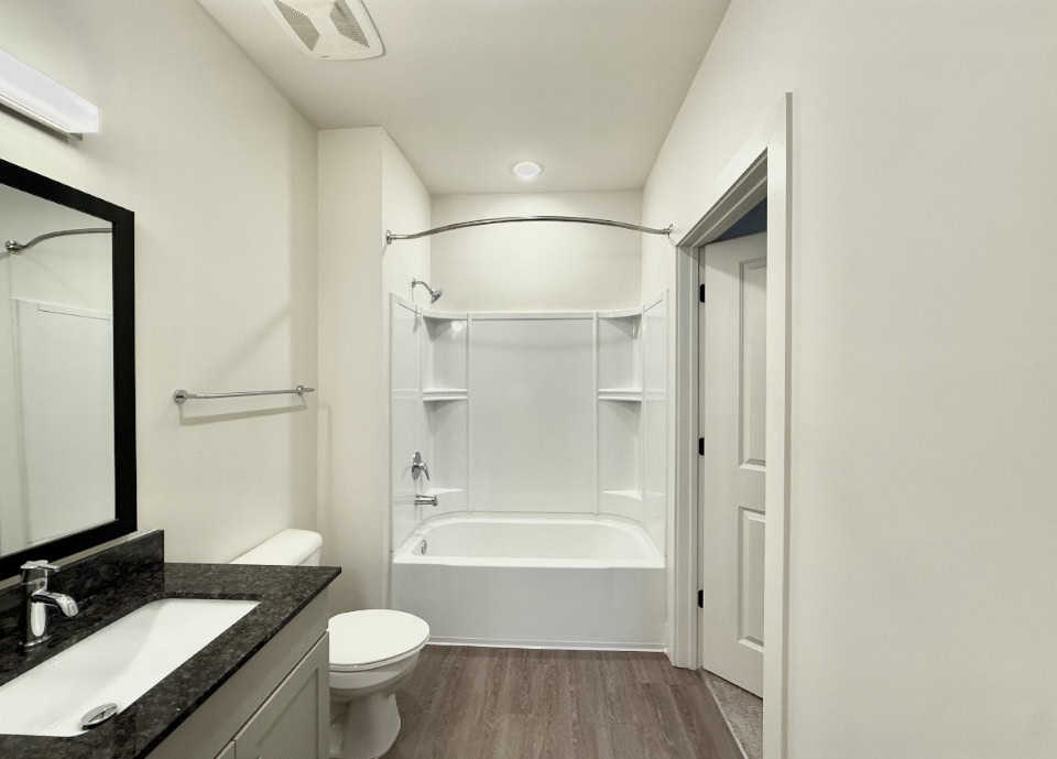 Nashville Apartment bedroom with a bath tub.
