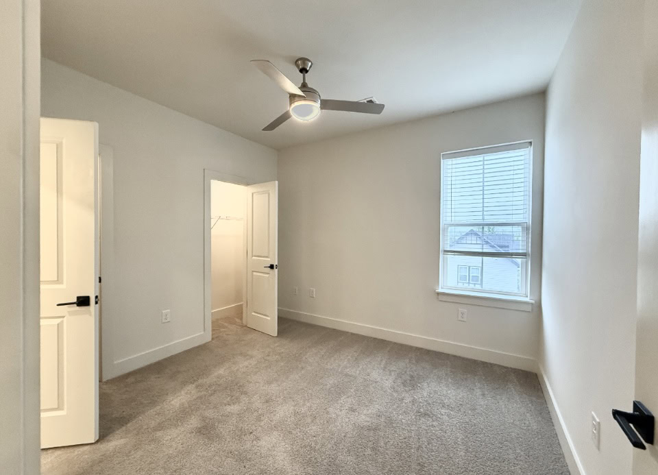 Nashville Apartment bedroom with carpeted floors.