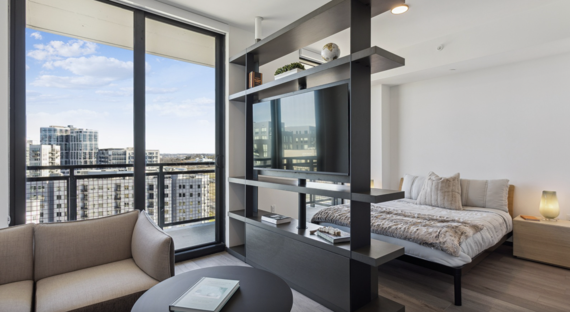 Nashville Apartment living room with floor to ceiling windows and built ins.