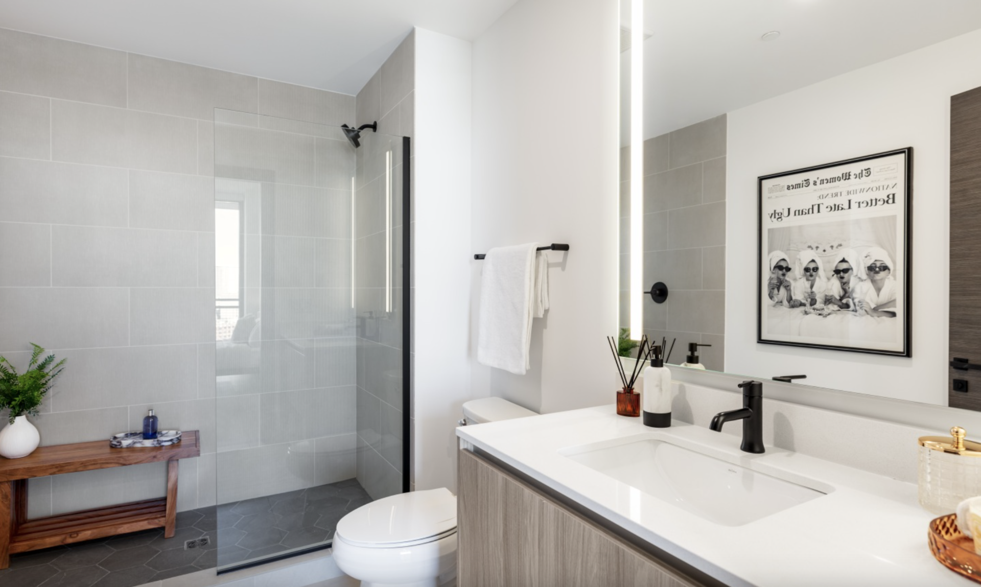 Nashville Apartment bathroom with LED lighting and a walk-in shower.