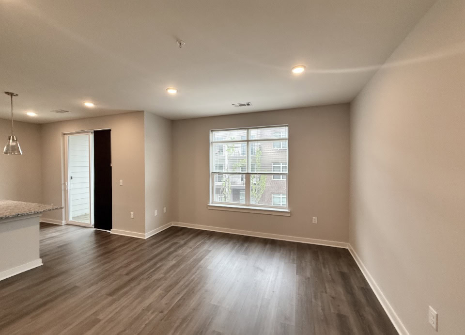 Nashville Apartment living room with wood floors, tons of space, and great natural light.