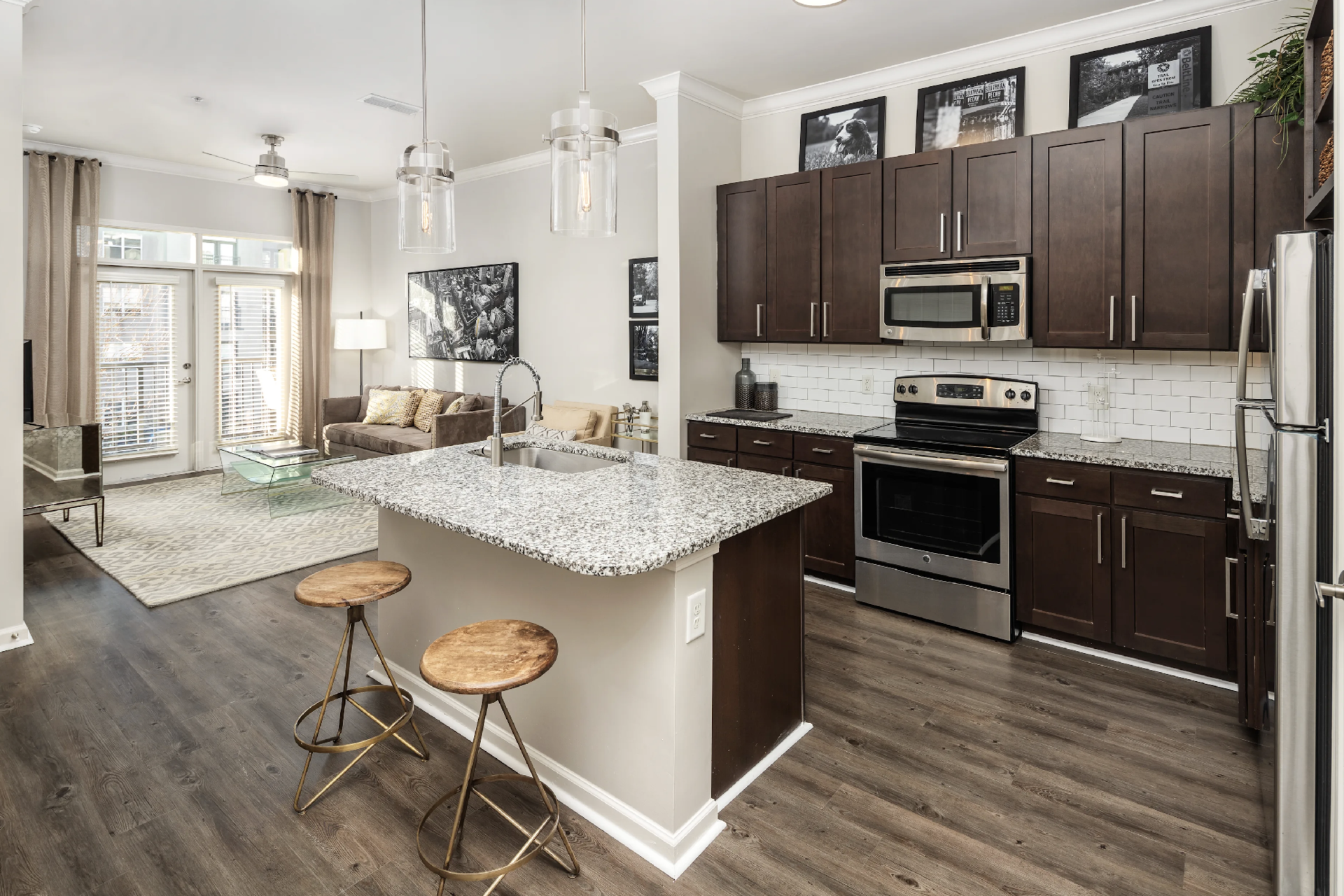 Atlanta Apartment kitchen with dark brown cabinets and stainless steel appliances.