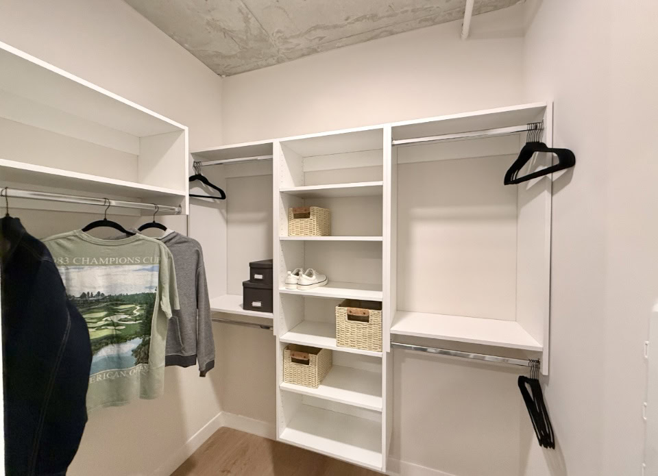 Nashville Apartment walk in closet with built in organization shelves.