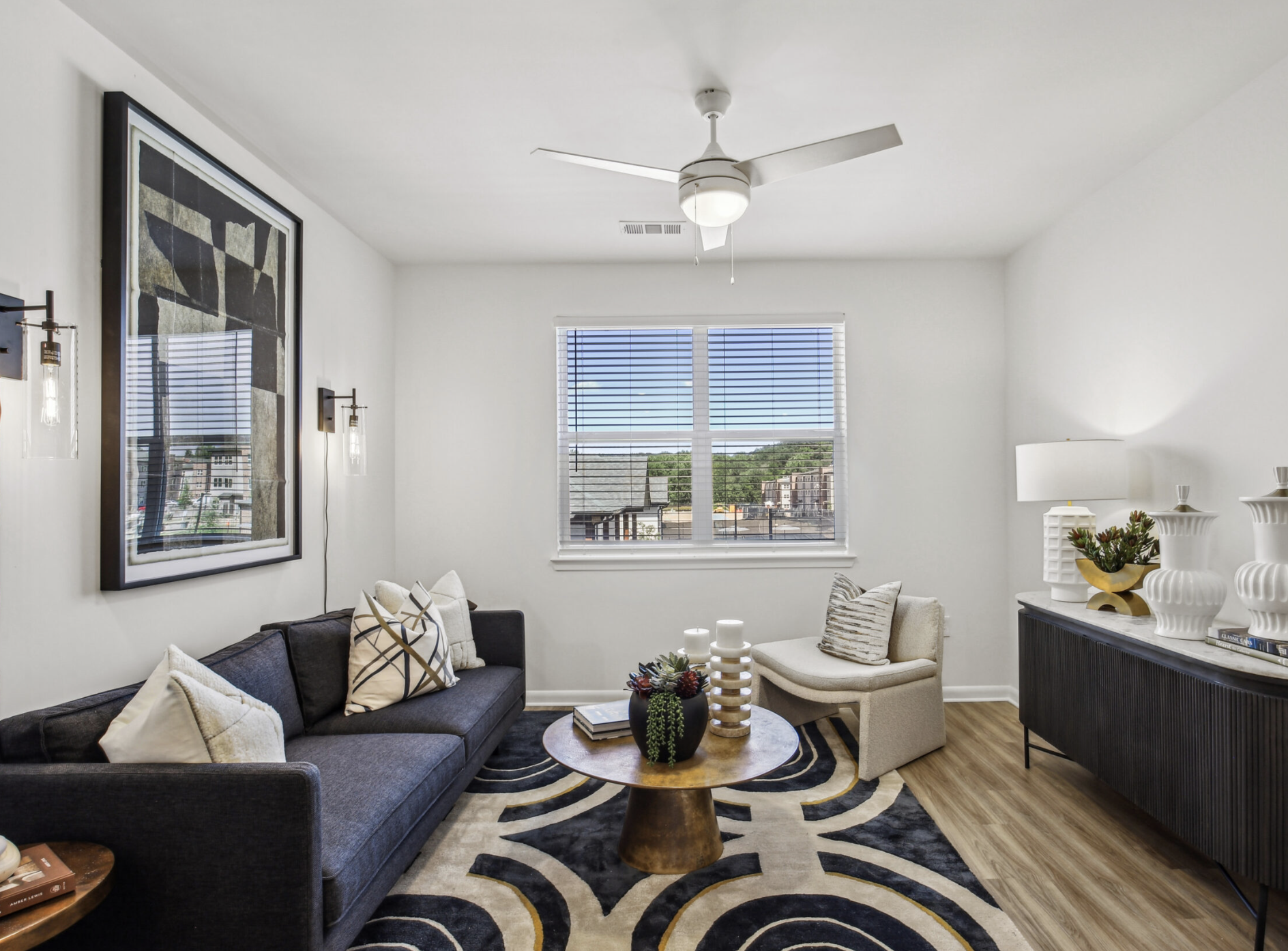 Atlanta Apartment living room with a large window and wood floors.