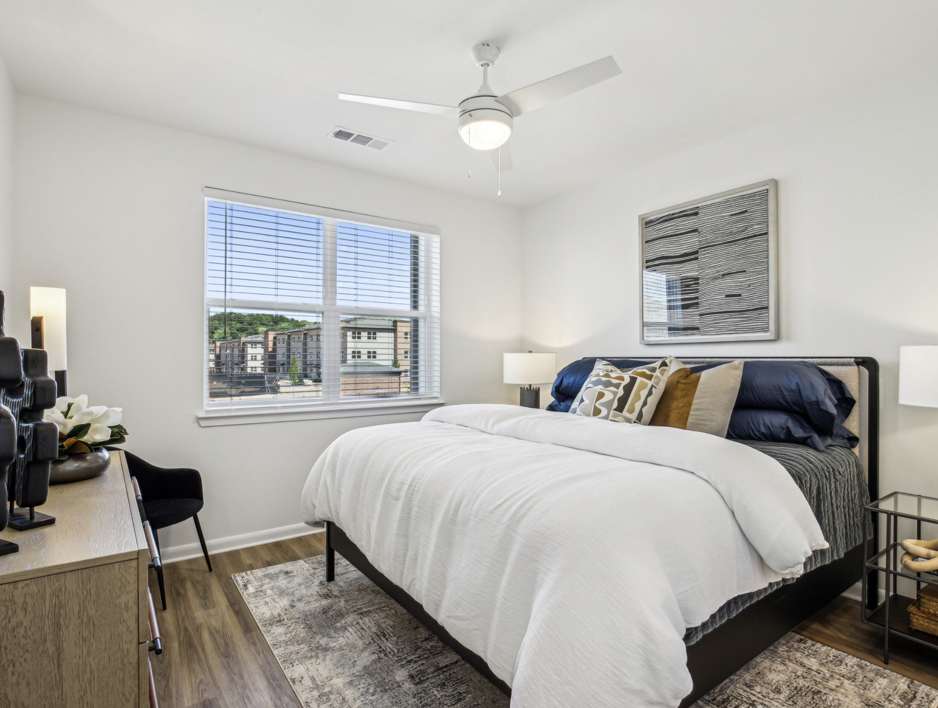 Atlanta Apartment large bedroom with wood flooring.